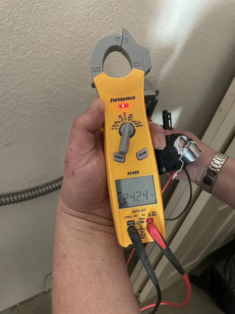 Voltage testing with clamp meter during Ceiling Fan Installation in Corrales